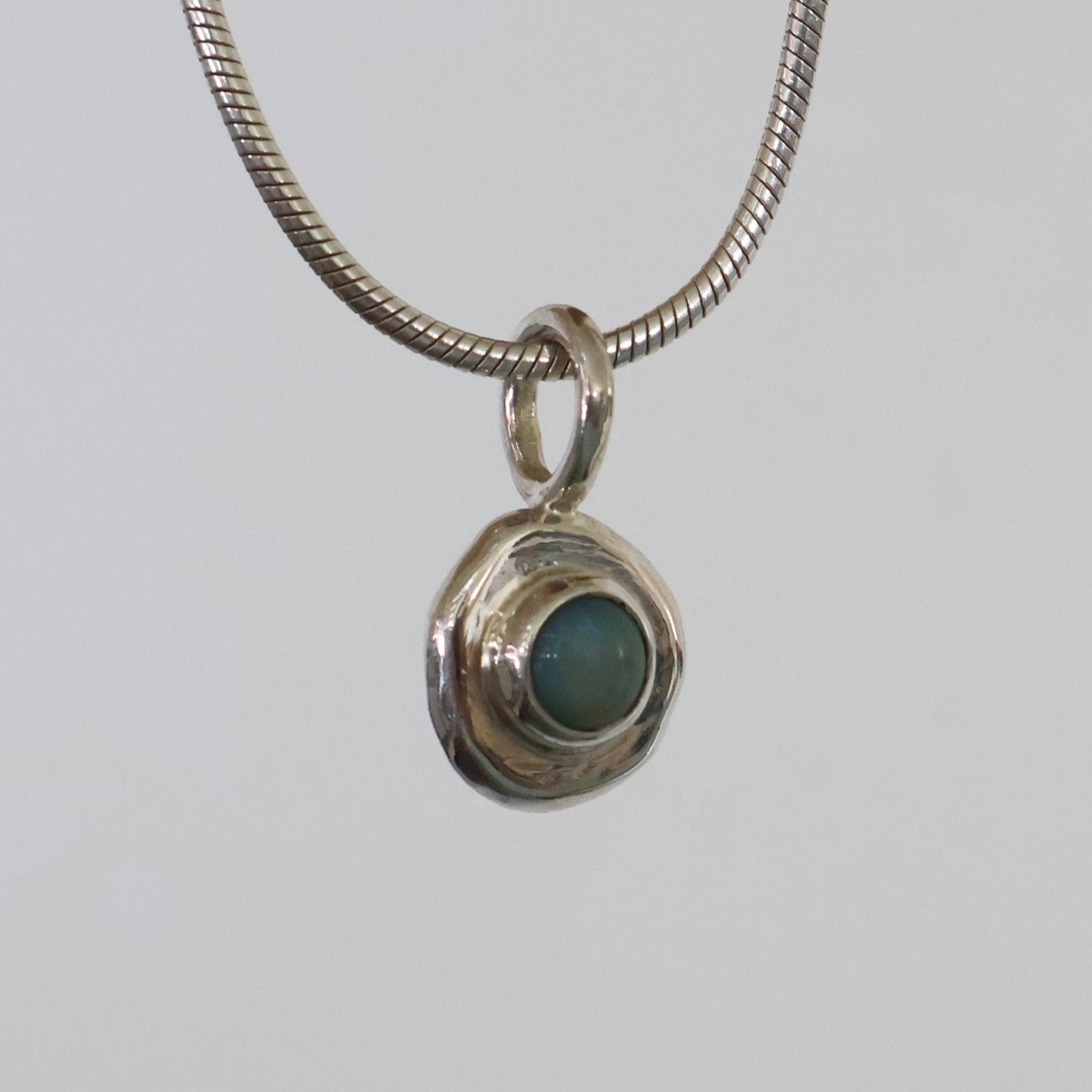Opal and fine silver pendant