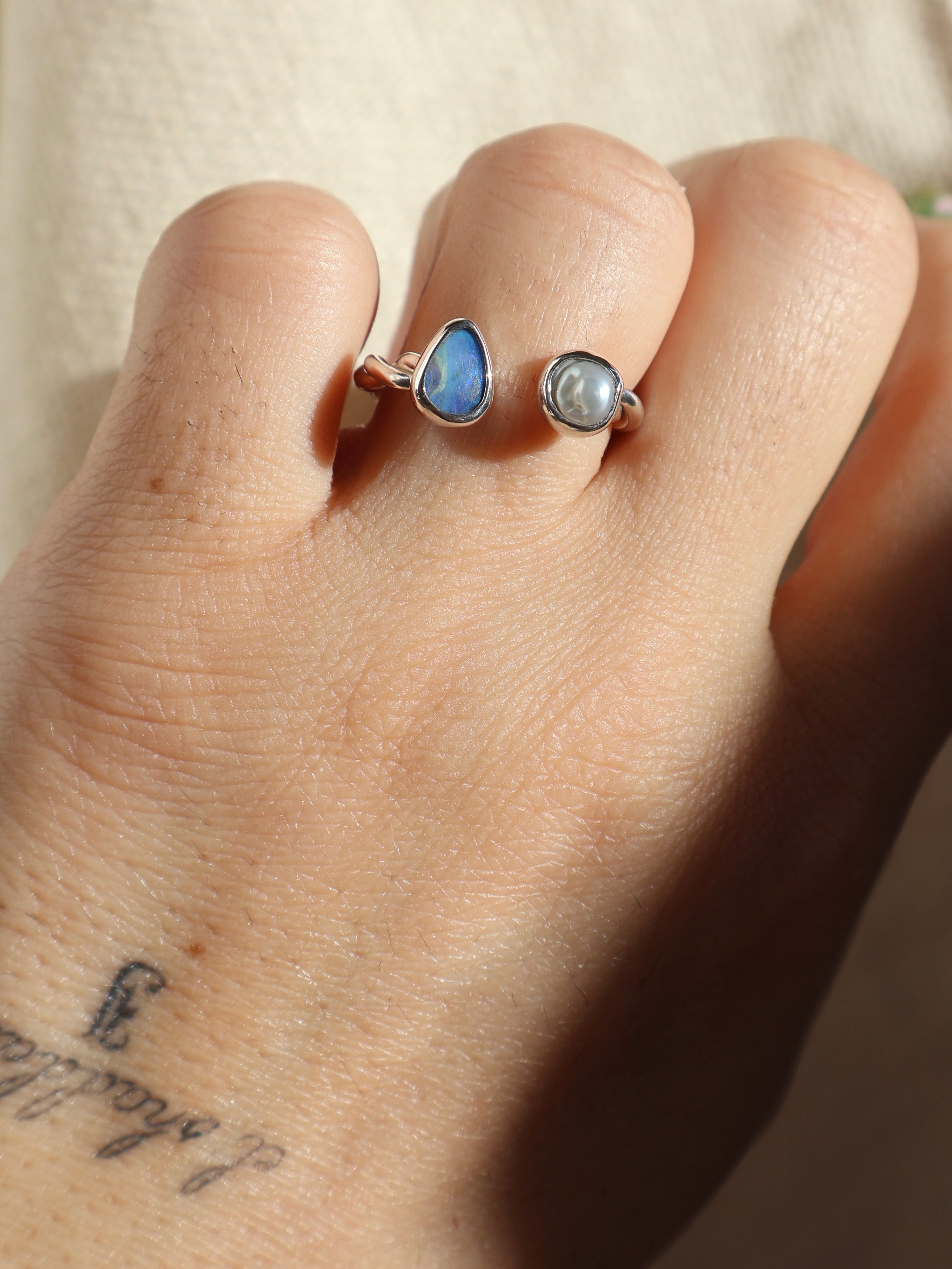 Twisted opal and pearl ring