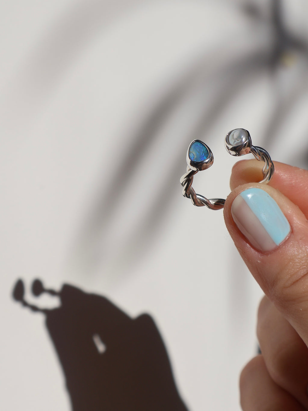 Twisted opal and pearl ring