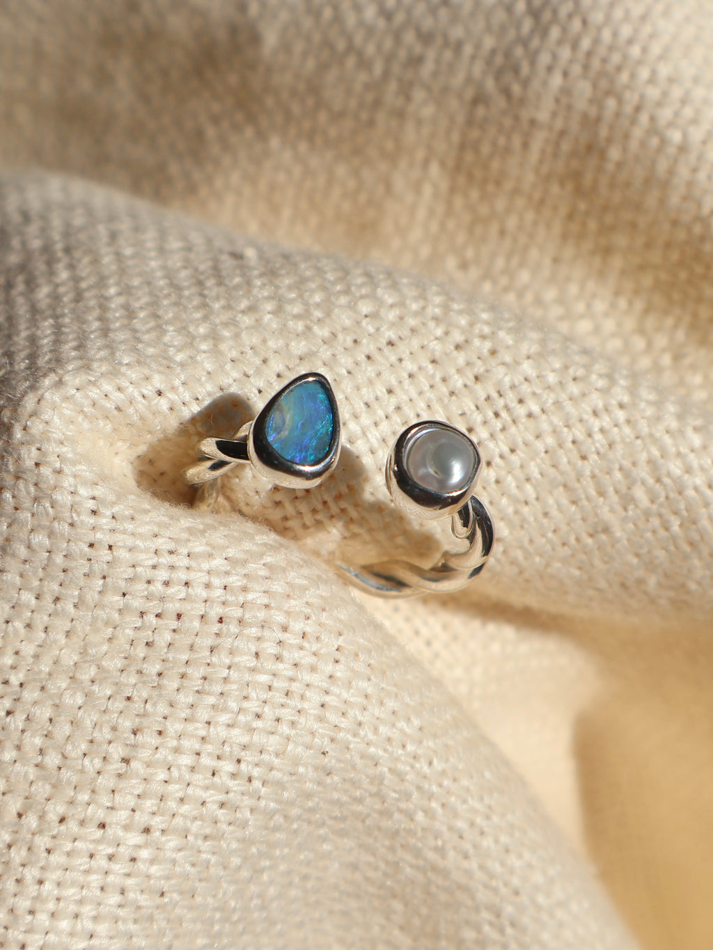 Twisted opal and pearl ring