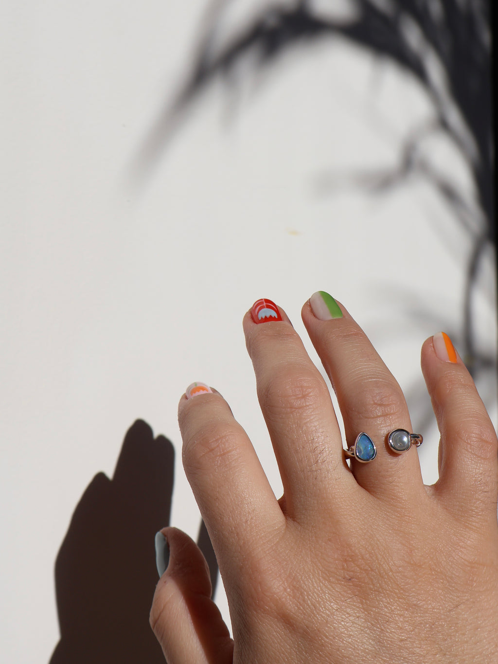 Twisted opal and pearl ring