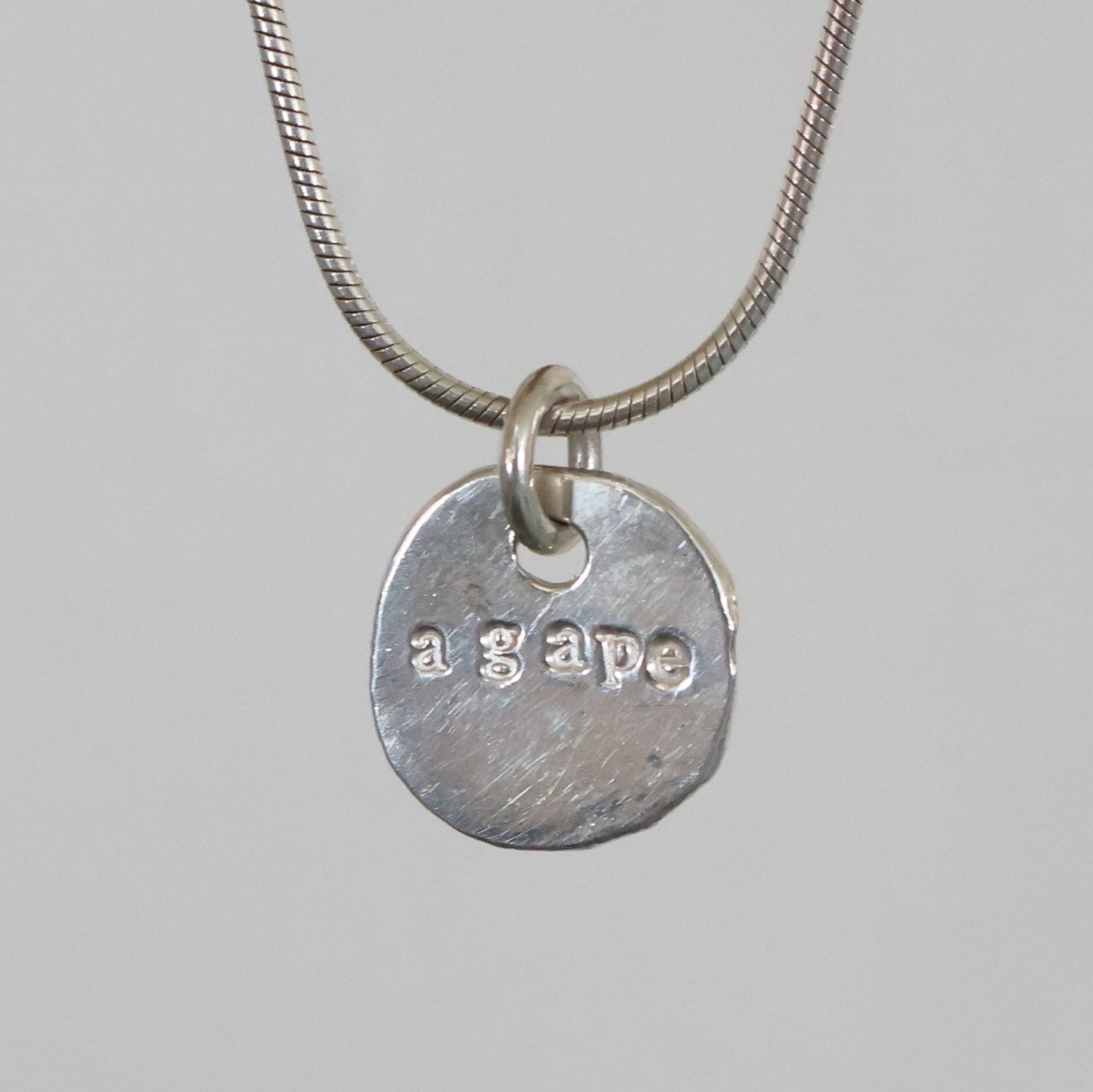 'Agape' coin pendant