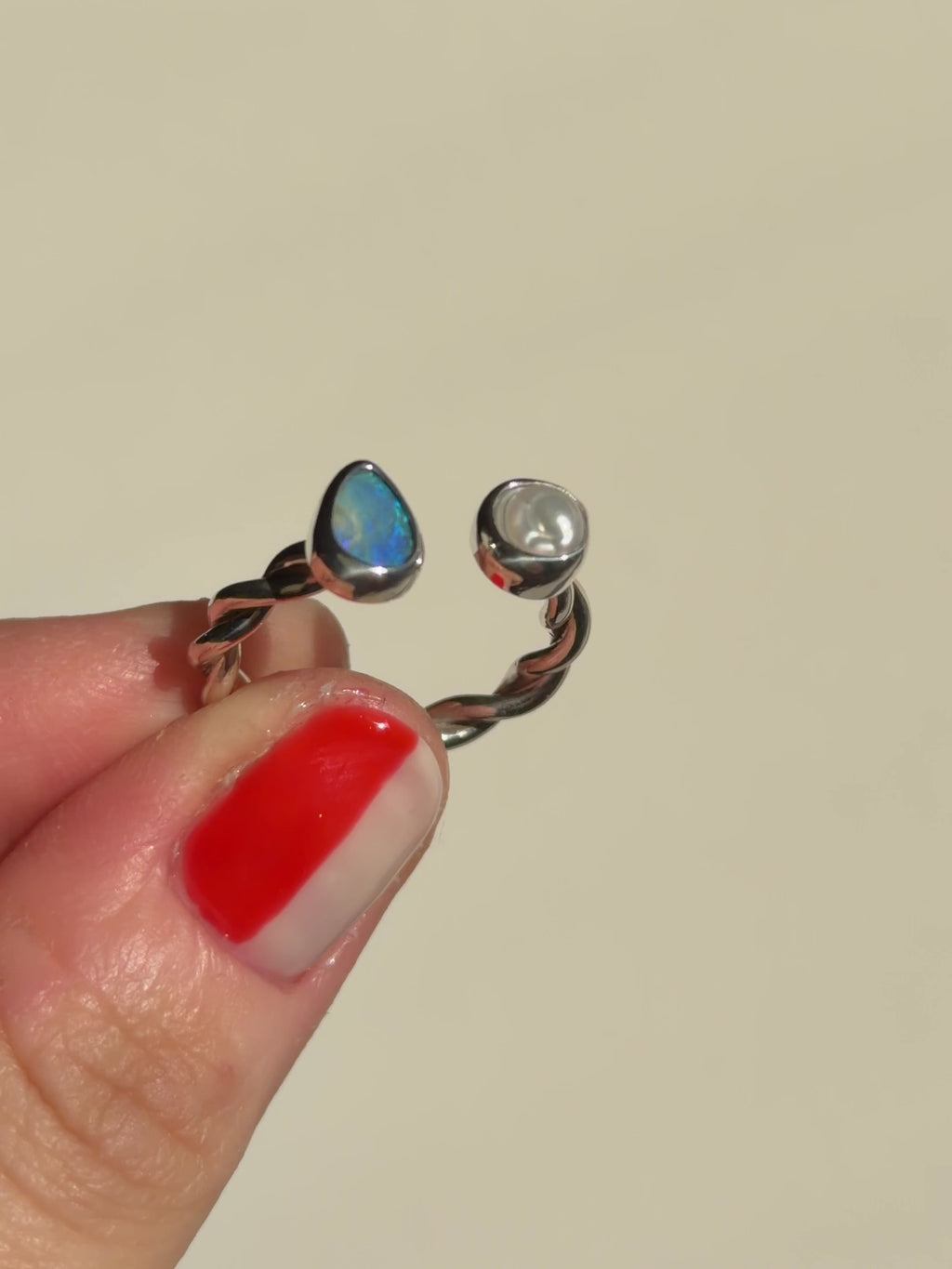 Twisted opal and pearl ring